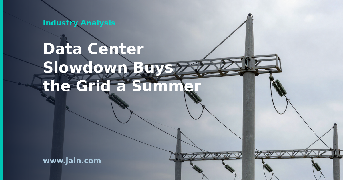 Power transmission lines beside a data center under construction at dusk, summer grid reliability theme
